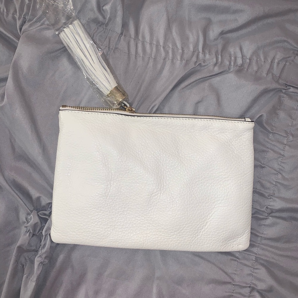 White clutch with tassel